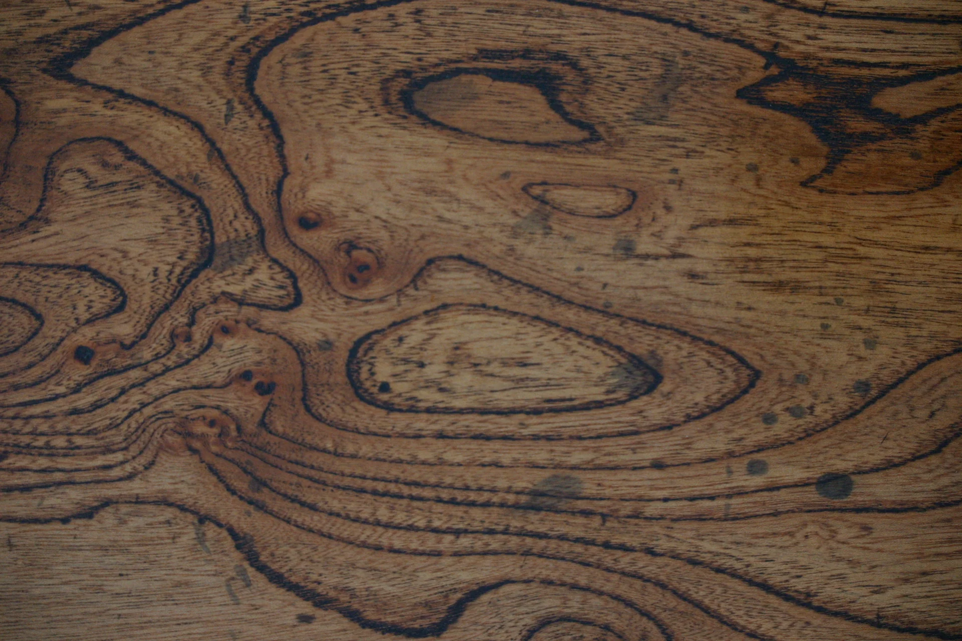 The figure in a solid elm board, selected for grain before the piece was cut