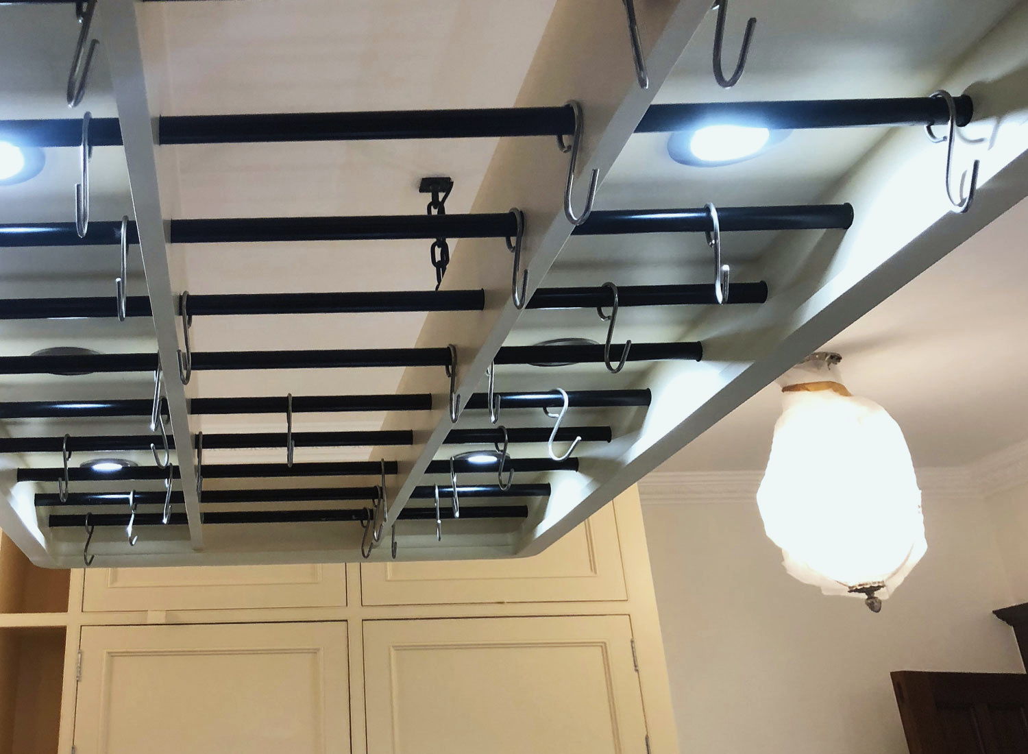 A hanging pot rack over the island