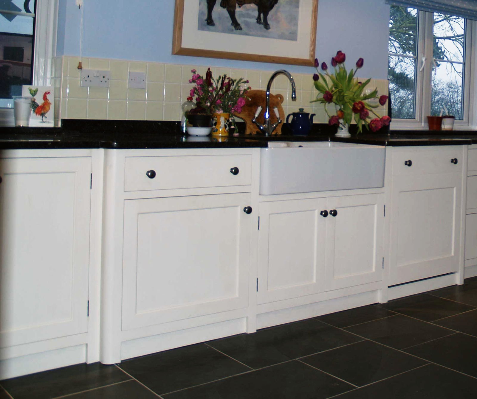 A painted in-frame run with a butler sink and a stone top