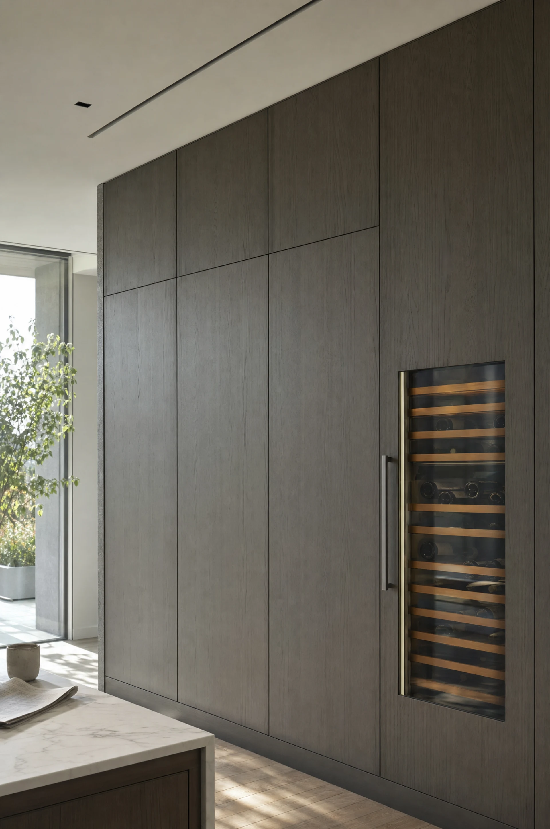 Appliances housed behind matching sprayed panels in a run of tall columns, The Kensington by Square & True