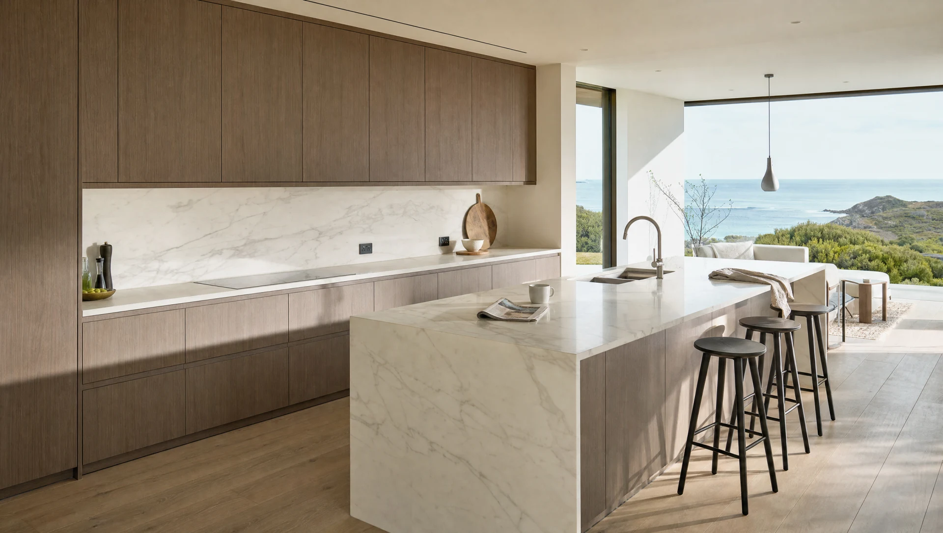 The Kensington in a coastal house, sprayed handleless cabinetry against daylight, Square & True