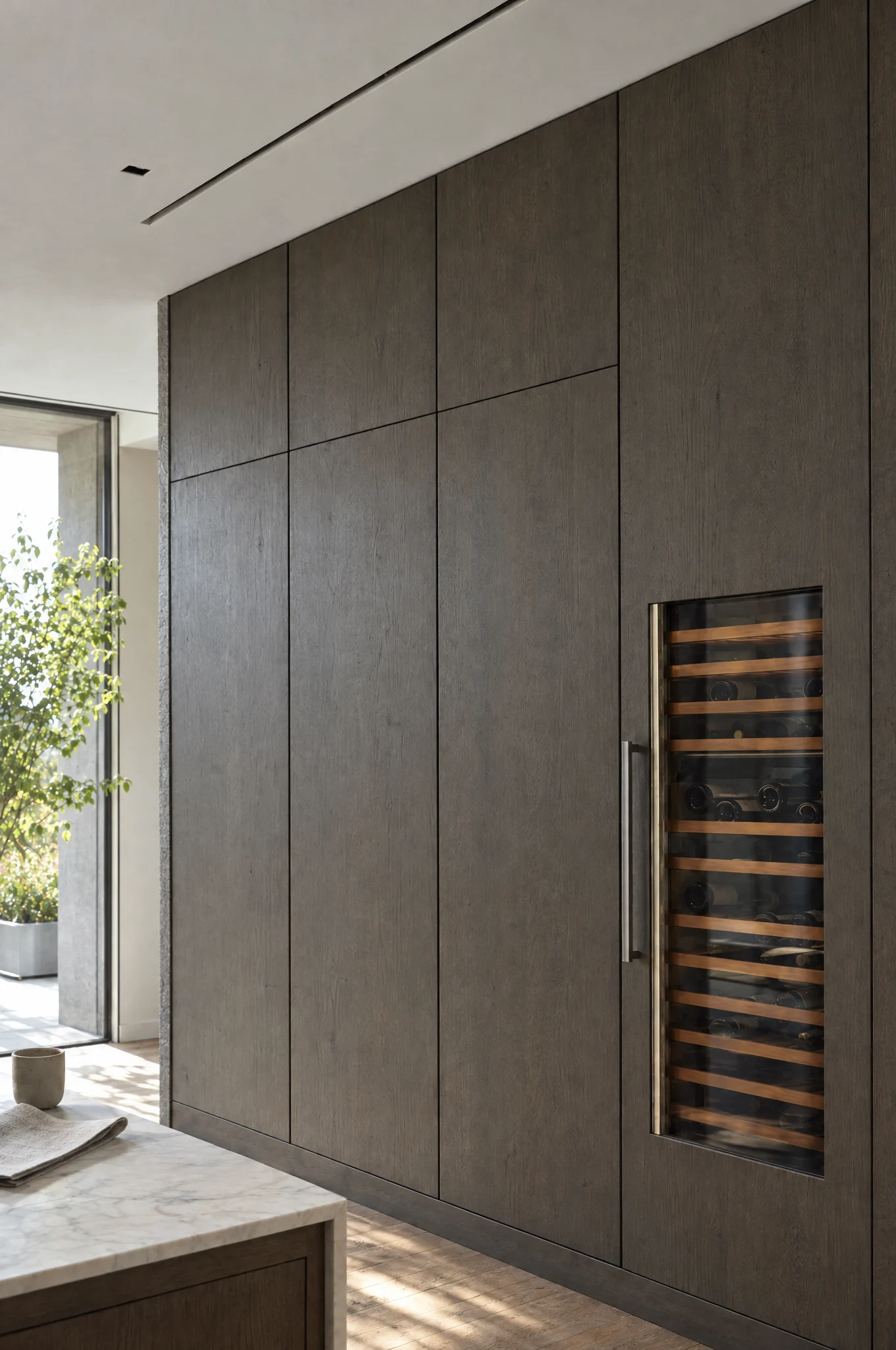 Appliances housed behind matching sprayed panels in a run of tall columns, The Kensington by Square & True