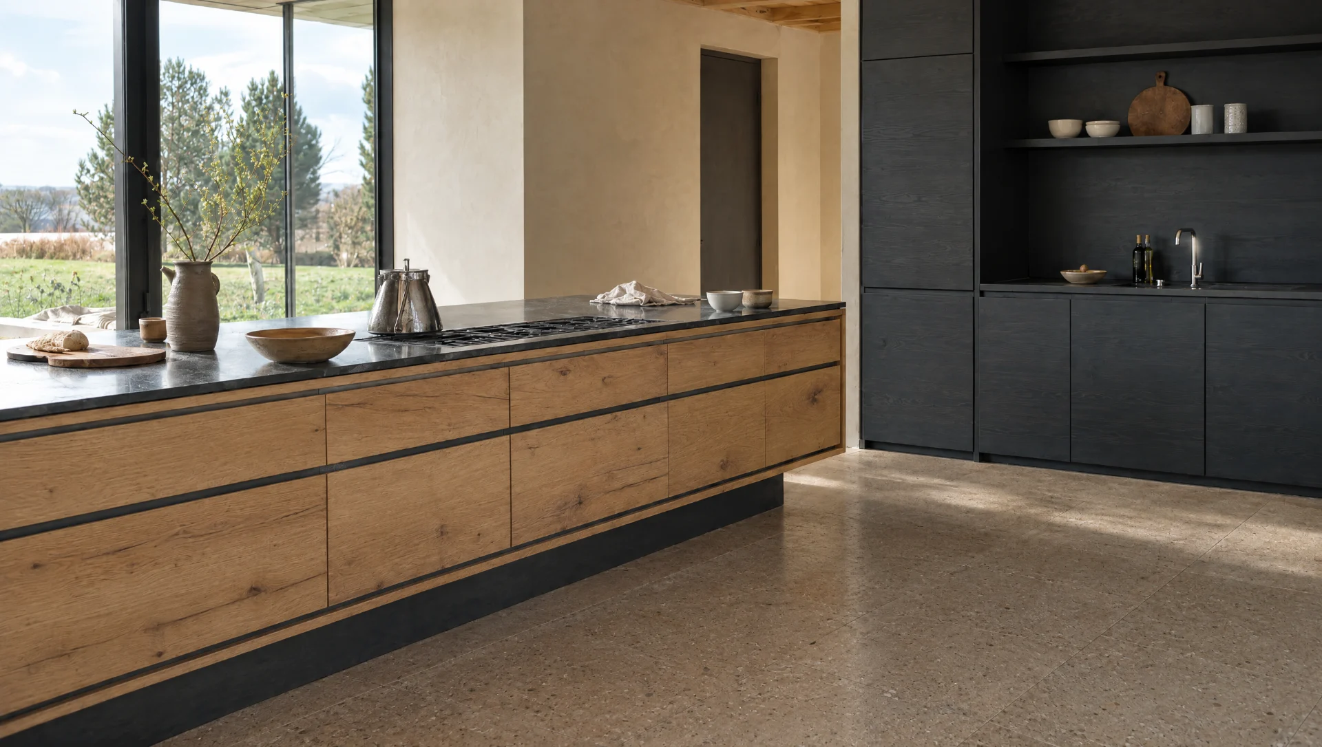 A matt black run with a stone worktop alongside character oak, The Scandi range by Square & True