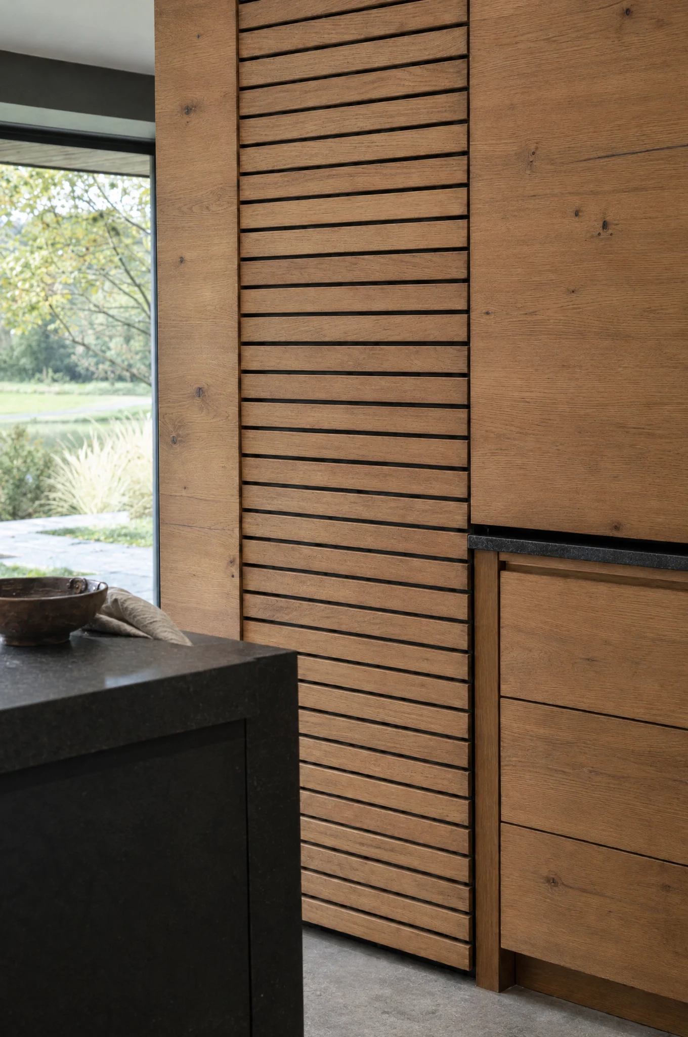 A slatted oak panel to the end of an island, The Scandi range by Square & True